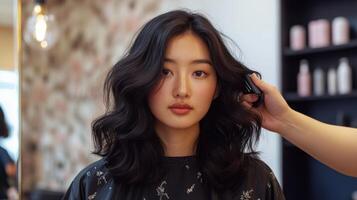 Stylish dark hair being styled in a salon. photo