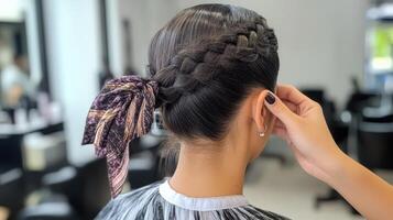 Stylish braided hairstyle adorned with a patterned scarf. photo