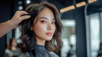 Elegant woman receiving a hairstyle at a salon. photo