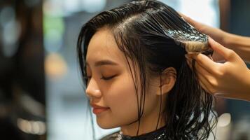 Close-up view of wet hair treatment in a salon. photo