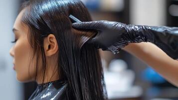 Close-up of a woman's hair treatment in a salon. photo