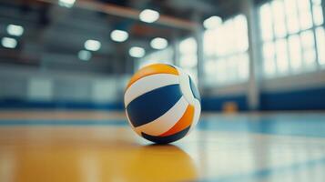 A Volleyball Rests On A Court In An Indoor Gymnasium Setting photo