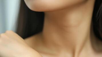 Close-up view of a person's neck and shoulder area. photo