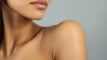 Close-up view of a woman's smooth skin and shoulder. photo