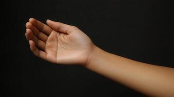 Close-up view of a light-skinned human arm and hand. photo
