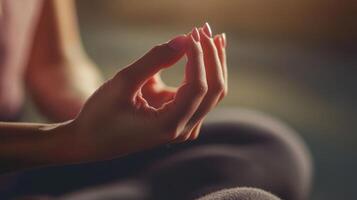 Close-up view of a person's hands in a meditation pose. photo