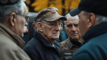 A group of older men are conversing in an outdoor setting photo
