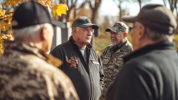 Four older men gathered outdoors engaging in thoughtful conversation photo