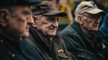 Elderly men sitting together observing a special event attentively photo