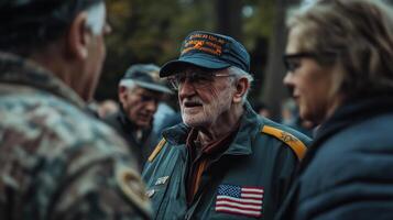 A veteran in conversation with people at an outdoor gathering photo