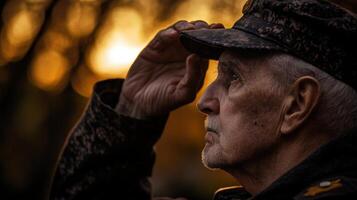 A veteran wearing a hat looking up at the warm sunlight photo
