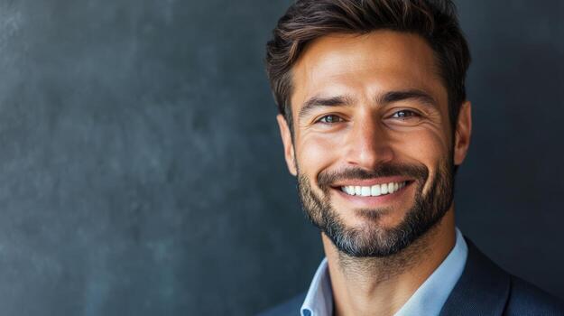 A smiling man is looking directly at the camera with confidence photo