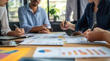 Several business professionals are working collaboratively in an office space photo