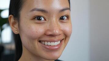 Close-up portrait of a smiling young woman with freckles. photo