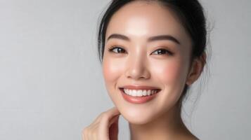 A radiant woman's portrait against a neutral background. photo