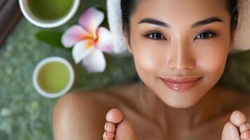 Relaxed woman enjoying a spa treatment with herbal teas. photo