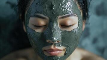 Close-up of a person wearing a dark gray facial mask. photo