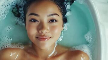 Relaxing, peaceful portrait of a person in a bath. photo