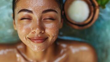 Relaxed woman enjoying a facial treatment. u photo