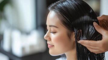 Close-up of a woman's hair treatment in a salon photo