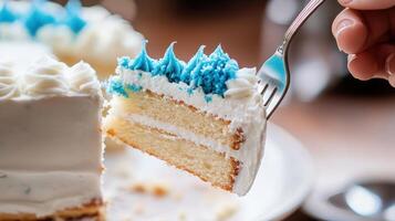 A delicious slice of layered cake being held on a fork photo
