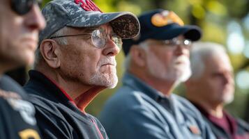 Four older men are looking forward in a blurred environment photo