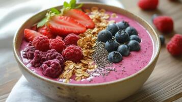 A healthy and colorful breakfast smoothie bowl with fresh berries photo