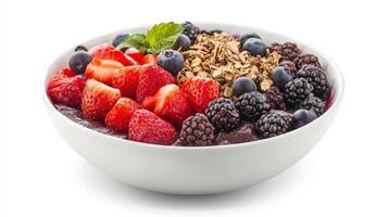 A bowl containing a healthy and colorful assortment of fresh fruit photo