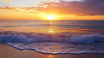 Sunset over ocean waves on a sandy beach. photo