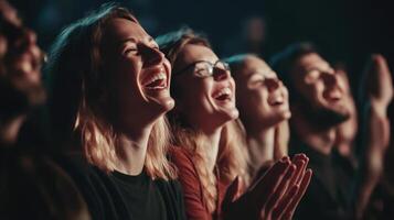 Smiling audience members enjoying a performance. photo