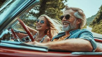 Smiling senior and teen enjoy a convertible road trip. photo