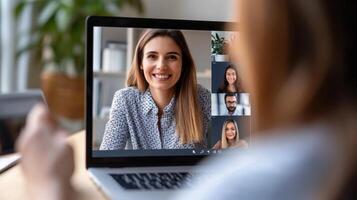 People attending a conference call on a laptop computer photo