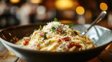 A delicious plate of pasta ready to be consumed quickly photo