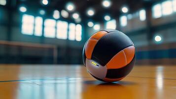 A unique sphere rests on a wooden indoor gymnasium floor photo