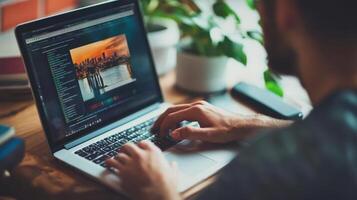 Person editing digital image on laptop computer. photo