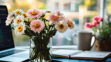 Vibrant flower bouquet on a desk near a window. photo