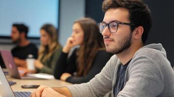 Focused young man attentively listens during a meeting. photo