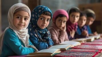 Focused children in a row studying religious texts. photo