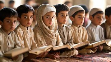 Focused children studying religious texts in a classroom setting. photo