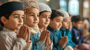Children in prayerful poses within a religious house of worship. photo