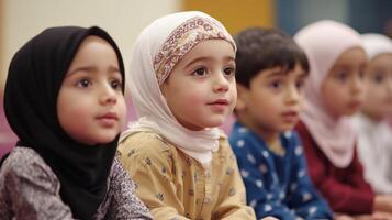 Attentive young children in a classroom setting. photo