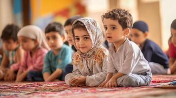 Attentive young children seated in a classroom. photo