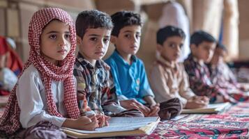 Young students seated attentively in a classroom setting. photo