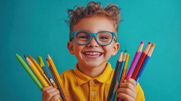 Happy Child Holding Colorful Pencils Smiling photo