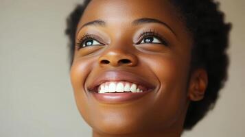 Smiling African Woman Portrait with Positive Expression, Shiny Skin, White Teeth photo