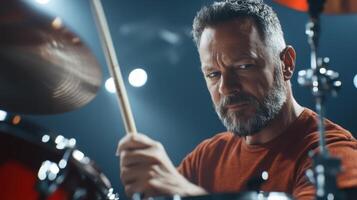 Intense Drummer Performance. Power and Passion with Sticks and Drums Set on Stage photo
