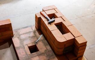 Construction of a stove to heat a wooden house. Assembly of the stove structure for heating a room and a bathhouse photo