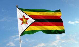 Zimbabwe national flag waving in clear sky photo