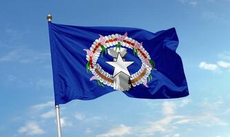 Flag of Northern Mariana Islands waving with latte stone and star emblem photo