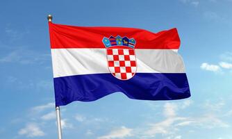 Croatian national flag waving in the wind photo